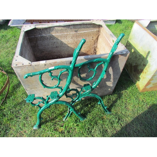 5400 - A pair of green painted arboreal bench ends