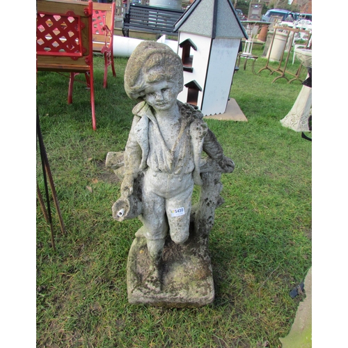 5430 - A composition weathered water outlet of boy on fence, 29