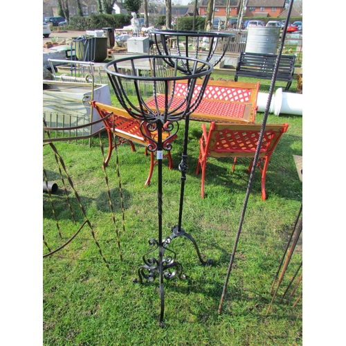 5433 - Two iron tripod base pot stands