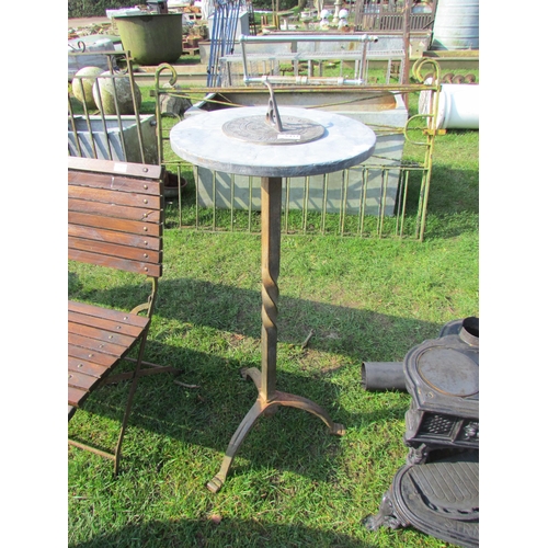 5437 - A brass sundial on round marble base on twisted iron stand