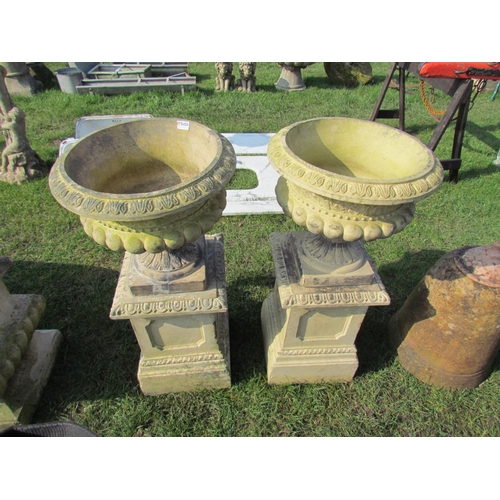 5458 - A pair of buff Doulton urns, decorative rims, gadrooned bowls on plinths, 35