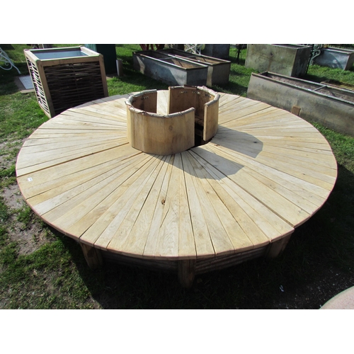 5465 - An oak and hazel four section tree seat  (r)  £300