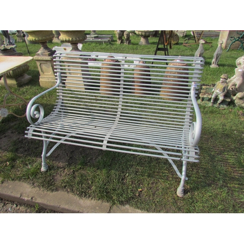 5469 - A French metal 4ft garden bench with scrolling arms, hoof style feet