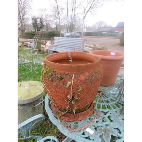 5070 - A weathered terracotta pot on stand, 13.5