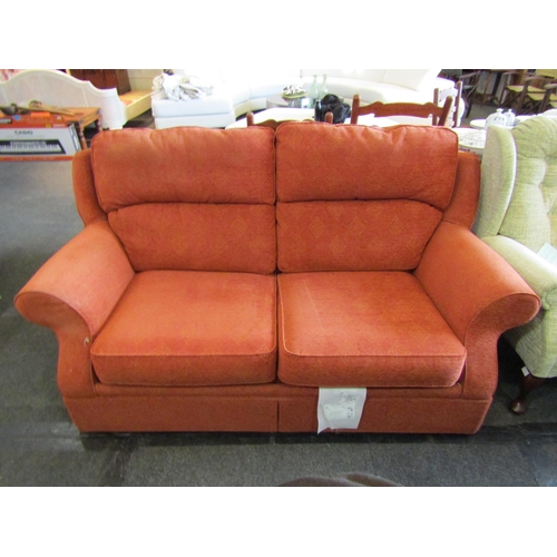 1139 - A Marks & Spencer terracotta upholstered two seater sofa bed