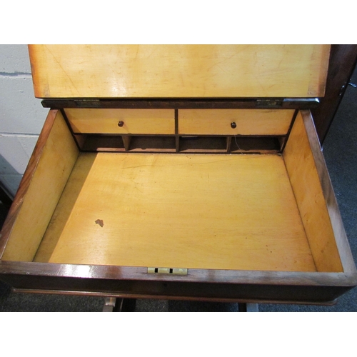 1023 - A walnut davenport desk with gilt leather insert, four drawers and four faux, on castors, 84cm tall ... 