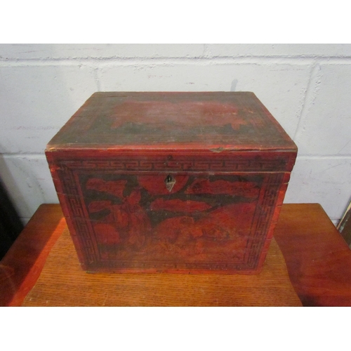 1063 - An Oriental red and black storage box decorated with figural scene (a/f), together with a pipe stand... 