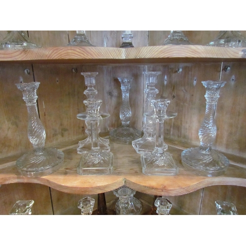 1078 - Eight pairs of pressed glass early 20th Century candlesticks plus four other candlesticks