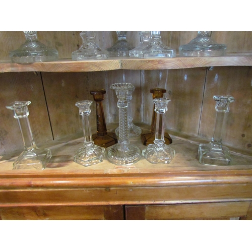 1078 - Eight pairs of pressed glass early 20th Century candlesticks plus four other candlesticks