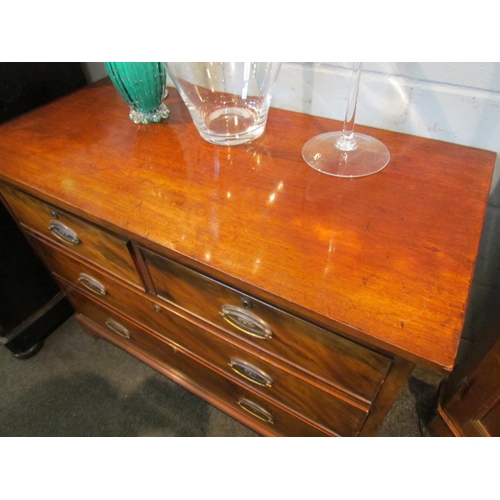 1083 - A 19th Century mahogany chest of two short over two long drawers, oval brass plate handles, on brack... 