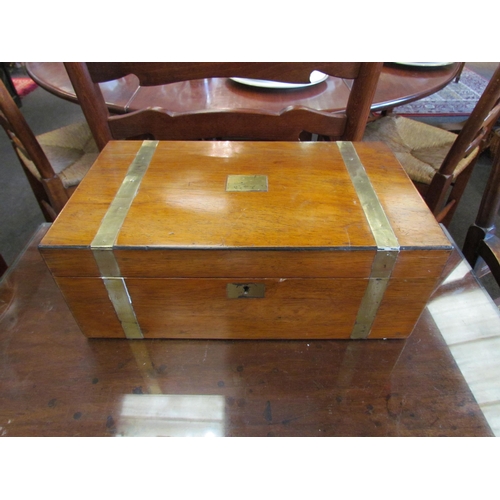 1103 - A Victorian walnut and brass banded writing box, restored