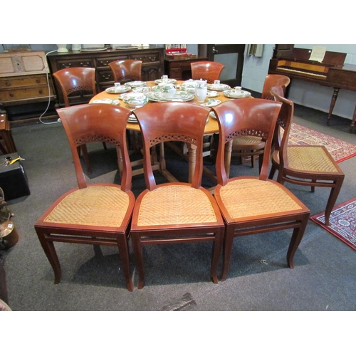 1114 - A set of eight high back dining chairs (probably cherrywood) with rattan seats on outswept fore legs