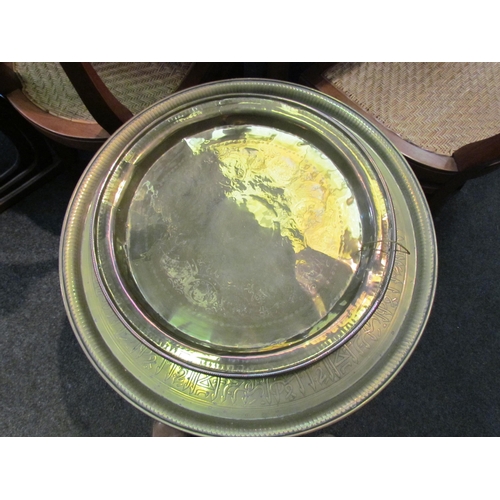 1115 - An Eastern brass table on wooden base and a circular brass tray a/f