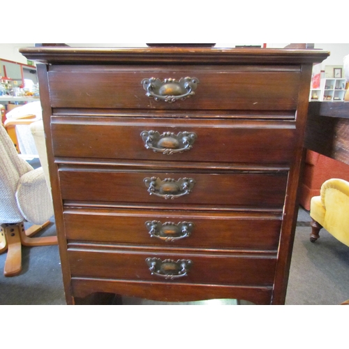 1132 - An Edwardian walnut music cabinet, the five drawers over open shelves, 110cm tall x 50cm wide x 36cm... 