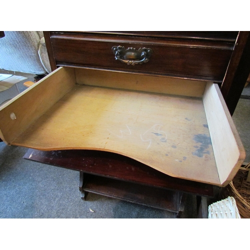 1132 - An Edwardian walnut music cabinet, the five drawers over open shelves, 110cm tall x 50cm wide x 36cm... 