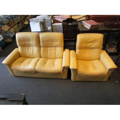 1133 - A Stressless two seater yellow leather reclining sofa and matching swivel recliner chair