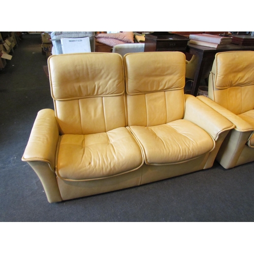 1133 - A Stressless two seater yellow leather reclining sofa and matching swivel recliner chair