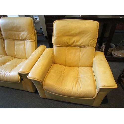 1133 - A Stressless two seater yellow leather reclining sofa and matching swivel recliner chair