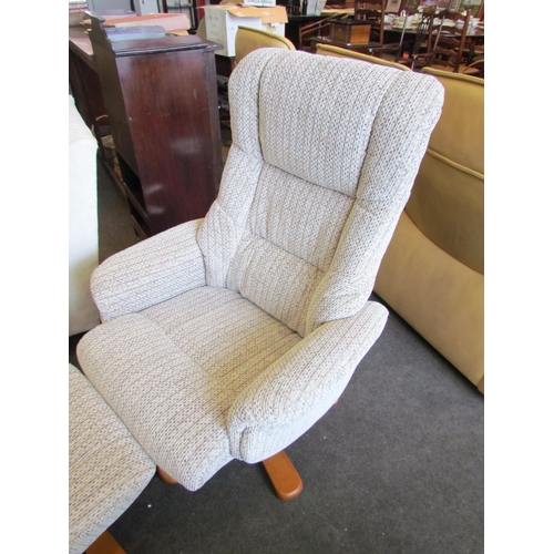 1135 - A modern recliner chair, beech base with matching stool