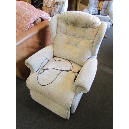 1143 - An electric reclining armchair, grey upholstery