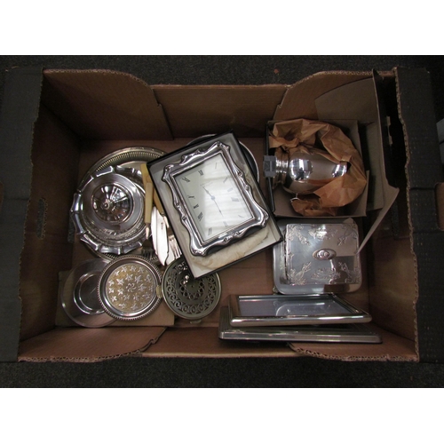 1165 - A box of plated wares to include sardine dish, salver, clock, picture frames, etc