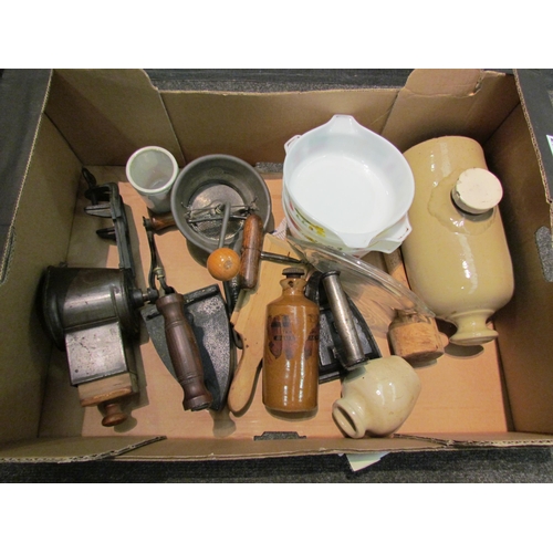 1167 - A box of kitchenalia to include box iron, butter pats, stoneware hot water bottle, etc.