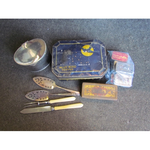 1198 - A box of miscellaneous to include plated biscuit box, vintage tins, loose cigarette cards