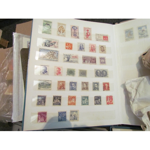 1215 - A box containing stamp albums with worldwide content, matchbox covers and Nestle cards    (E) £15-25