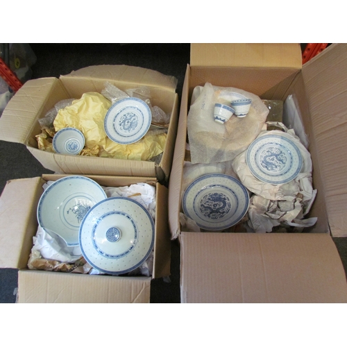 1217 - Three boxes of blue and white Chinese rice pattern dinner service, some a/f