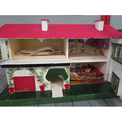 1230 - A two storey dolls house, 35cm tall x 60cm long