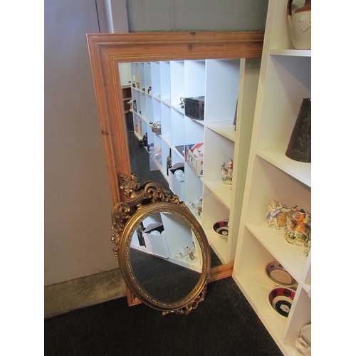 1240 - A pine rectangular mirror, 98cm x 69cm, and a resin gilded ornate mirror with vase cornice (2)