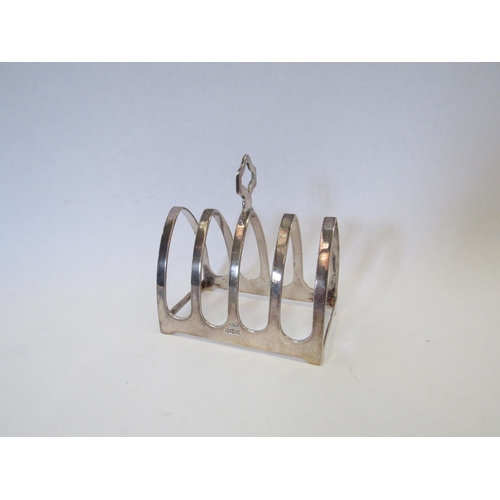 1297 - A silver four slice toast rack.  Sheffield 1964.  Viner's Ltd.  Approximately 50g