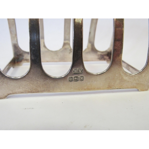 1297 - A silver four slice toast rack.  Sheffield 1964.  Viner's Ltd.  Approximately 50g