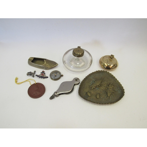 1303 - A box of miscellaneous to include brass pin dish, brass and glass inkwell, etc