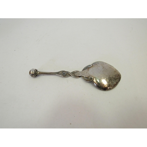 1337 - An Arts & Crafts white metal hammered spoon, handle intertwined and cabochon to terminal, a shell an... 