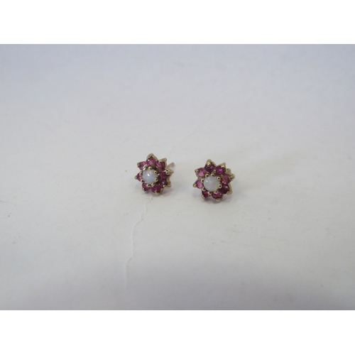 1343 - A pair of 9ct gold, opal and ruby set floral design earrings