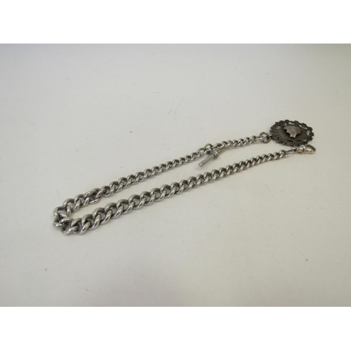 1345 - A heavy graduated link silver watch chain with T-bar and dog clip with silver fob attached.  Approxi... 