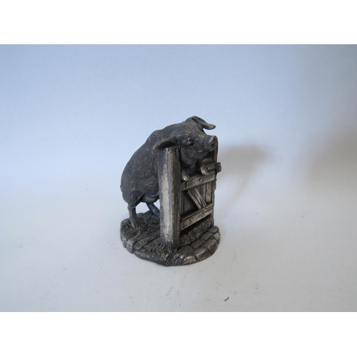 1363 - A sterling silver figural sculpture of a pig climbing on gate, 8cm high