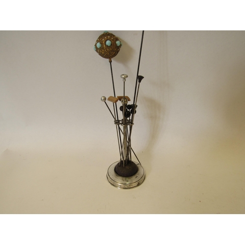 1369 - A silver hat pin stand together with various hat pins and three pairs of earrings