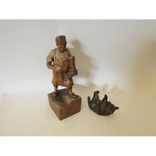 1382 - A carved wood figure of a man with a pair of boots hung over his shoulder 23cm tall and a small Blac... 