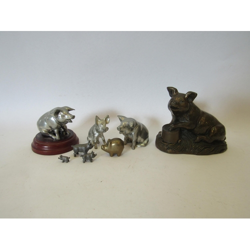 1386 - A 'Purbeck Designs' bronzed sculpture of a pig together with pewter pigs etc