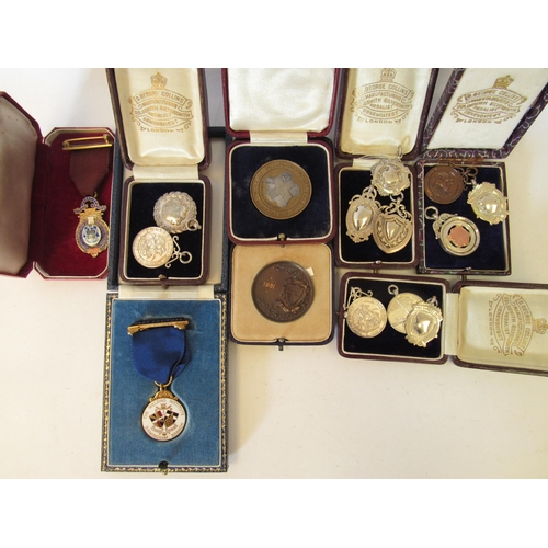 1388 - A collection of sports medals awarded to R.J. Fowler (1910-1979) who worked at the Department of Tan... 