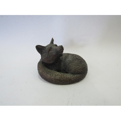 1243 - A bronze sculpture of a Fox, signed to back, 5cm tall