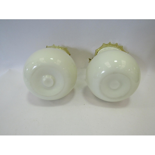 1244 - A pair of yellow glass bulbous form vases, 14cm tall