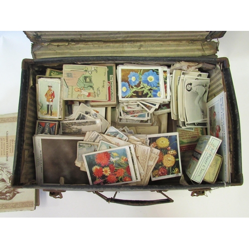 1251 - A suitcase containing cigarette cards, postcards etc to include a booklet 