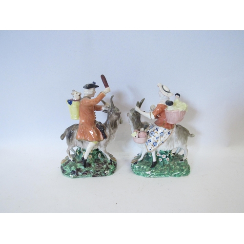 1259 - A pair of ceramic figures, Welsh tailor and his wife both riding goats together with a figure of che... 