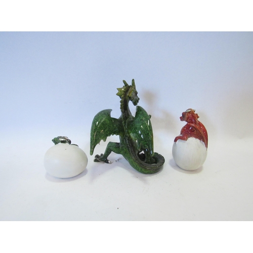 1273 - A ceramic green standing dragon 12cm tall, and two others hatching from eggs