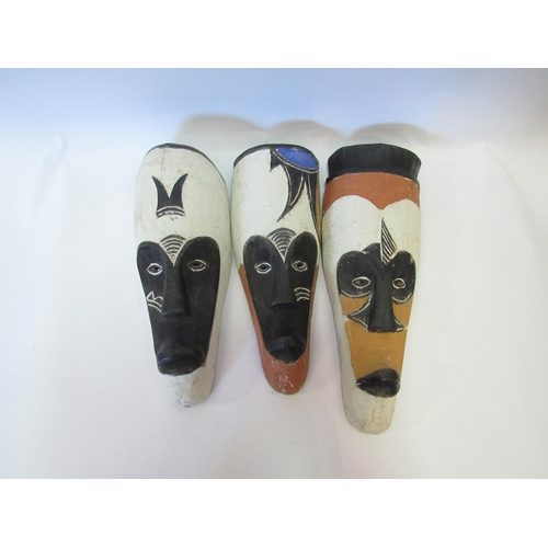 1274 - Three decorated African masks, tallest 33cm   (R) £20 with lot 1275