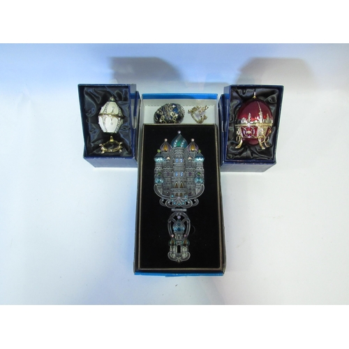 1279 - A 'Galaxy' Faberge style egg boxed, two similar, plus a Bernice Russian style hand mirror, boxed