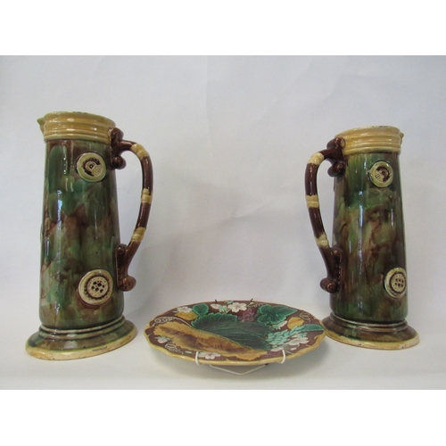 1399 - Two Victorian majolica jugs, bamboo effect handles, 29cm and 27cm tall, and a majolica ivy leaf plat... 